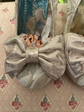 Irregular Choice Gold Bow Size