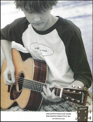Teen boy playing larrivee - teen,