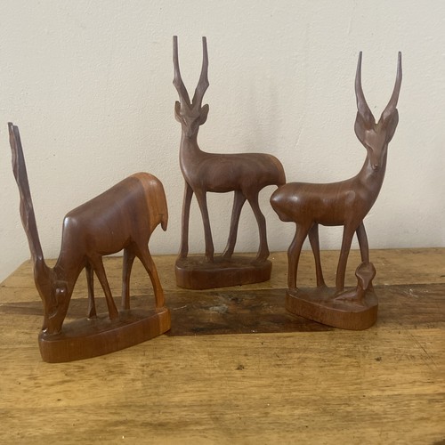 Three hand carved vintage - three,