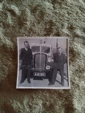 Two Men Stood Beside An