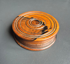 A 19thC circular treen snuff box with attractive dark striations in the timber.