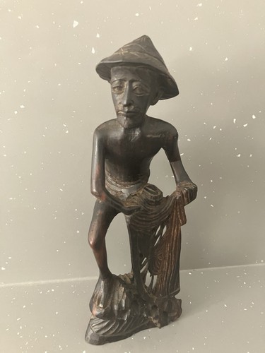 Hand carved wooden fisherman - hand,