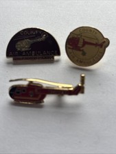 Three Air Ambulance Metal Badges. 