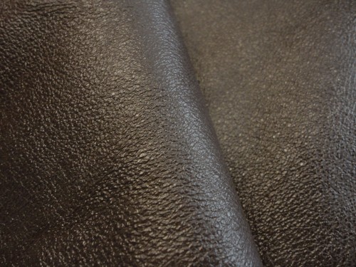Dark brown coated grained