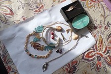 a silver wing brooch and other costume jewllery