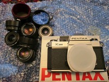 Pentax k1000 camera body new boxed, 4 pentax lenses 85mm, 28mm, 35mm + 50mm