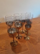 Gold stemmed wine goblets and