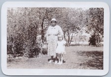 Older Woman in Floppy Hat &