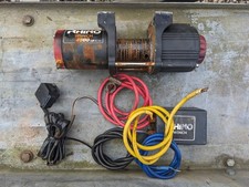 Rhino Winch 4500 lb for parts. Runs both ways but has a cracked casing
