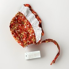 Dolly Wears Baby Bonnet Rust