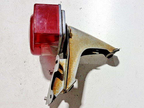 Tail light bracket - tail, assembly