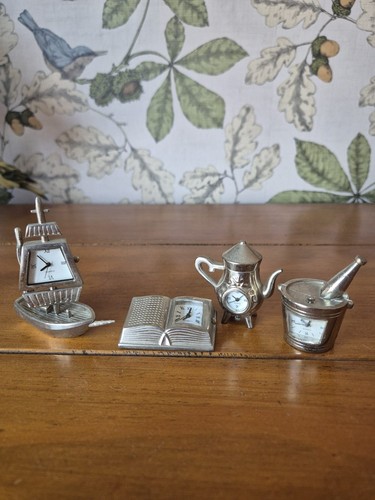 Set miniature clocks with - of,