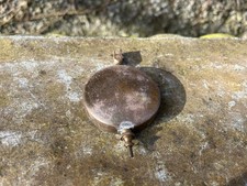 Antique clock pendulum.