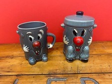 dusty bin money box and mug