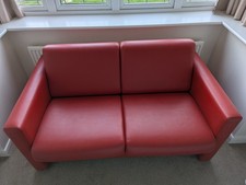 2 seater red leatherette sofa. Little used.