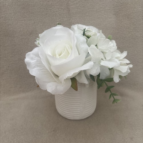 White planter with faux - planter,