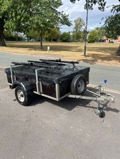 camping trailer with hard top and bike rack