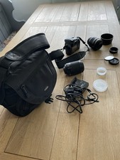 Nikon D60 DSLR Camera Bundle with 2 Lenses,  Battery Charger, lens filters & Bag