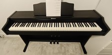 A Roland Digital Piano (RP102) in excellent condition