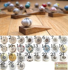 Ceramic door knob on wooden door stop.Choose your design. White patterned.