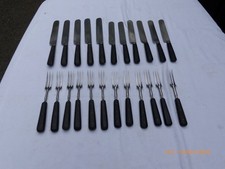 23 VICTORIAN CARBON STEEL KNIVES & FORKS WITH RIVETED WOODEN HANDLES
