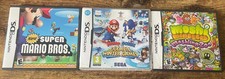 4 NINTEDO DS GAMES: Super Mario Bros, Mario & Sonic, Mario Party, Moshi Monsters