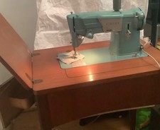 Vintage Singer sewing machine 327k with peddle and cabinet