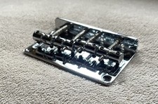 FENDER STYLE BASS BRIDGE… CHROME WITH 70s SADDLES. IN VERY GOOD CONDITION #3.
