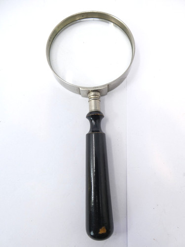 Hand held magnifying glass - hand,