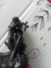 figurine often titled "The