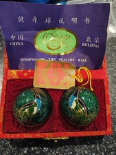 Pair of VINTAGE METAL CHINESE MUSICAL WORRY BALLS decorated with PEACOCKS