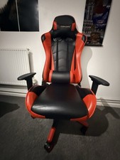 Red and black gaming chair with reclining back and adjustable height