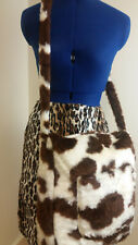 Faux Fur crossbody bag. This is a Brown cow print fur shoulder bag