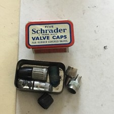 VINTAGE TIN SCHRADER TYRE VALVE CAPS , AND VALVE CORES.1922 .See Photos