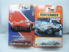Matchbox:   Aston Martin DBR1   x2   New but  light card damage read description