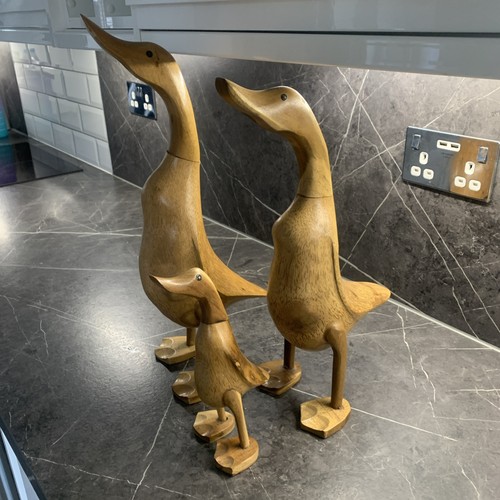 Three wooden ducks - three,