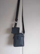 Multi compartment blue/grey small cross body bag with coloured strap. 