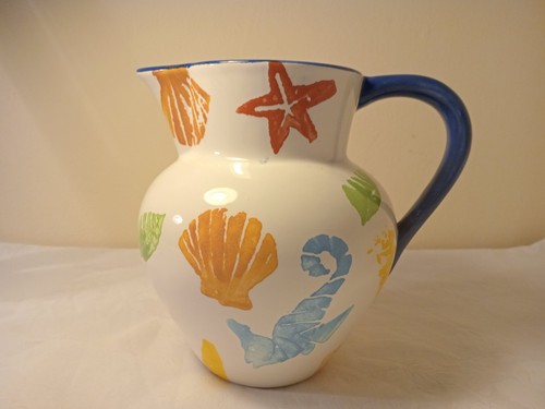 Hand decorated pottery jug - hand,