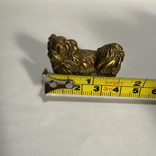 Solid brass amber - figurine, of
