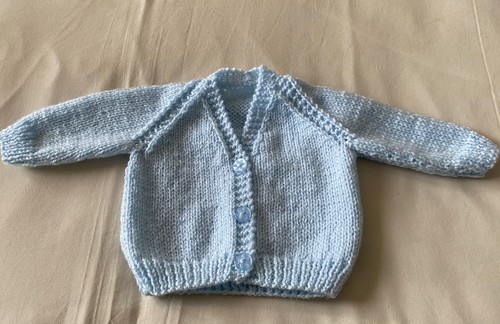 Hand knitted pale blue - hand,