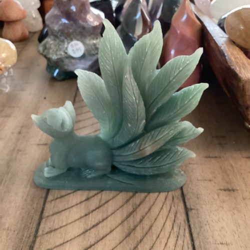 Carved stone fox - stone, tails