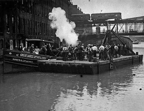 Divers work a barge - at,
