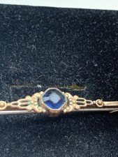 Vintage Bar Brooch with Blue Glass In Centre Gold Tone Metal  ,used .