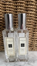 Joe Malone perfume bottles, pomegranate Noir and lime basil and mandarin