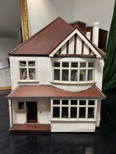 1930s Vintage Dolls House with furniture. Front & rear opening. Untested lights 