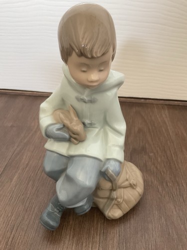 Nao boy seated with - boy,