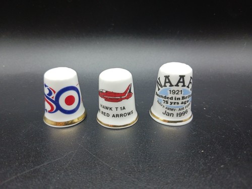 Three porcelain thimbles with - porcelain,