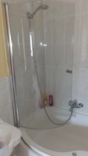 USED PIVOT CURVED CORNER OVER BATH SHOWER GLASS SCREEN WITH HANDLE