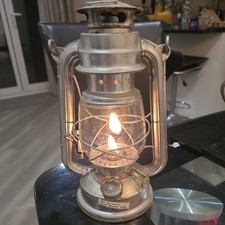 Old vintage metal & glass paraffin lamp. Lamp oil included.  Good working order