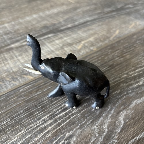 Black elephant with tusks - with,
